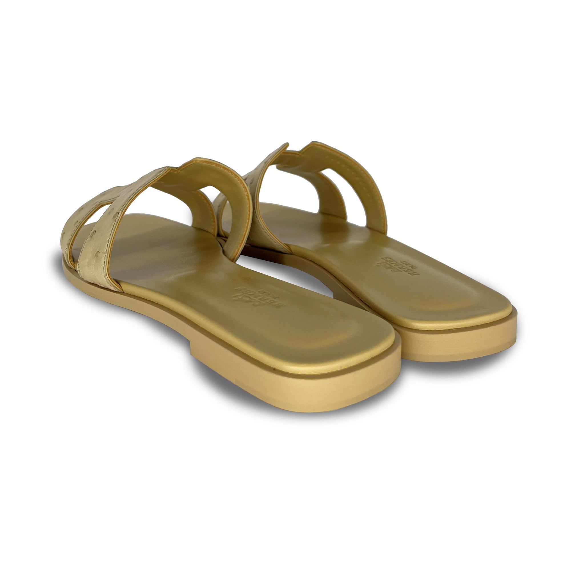 Hermes Nude Ostrich Oran designer sandals back angle