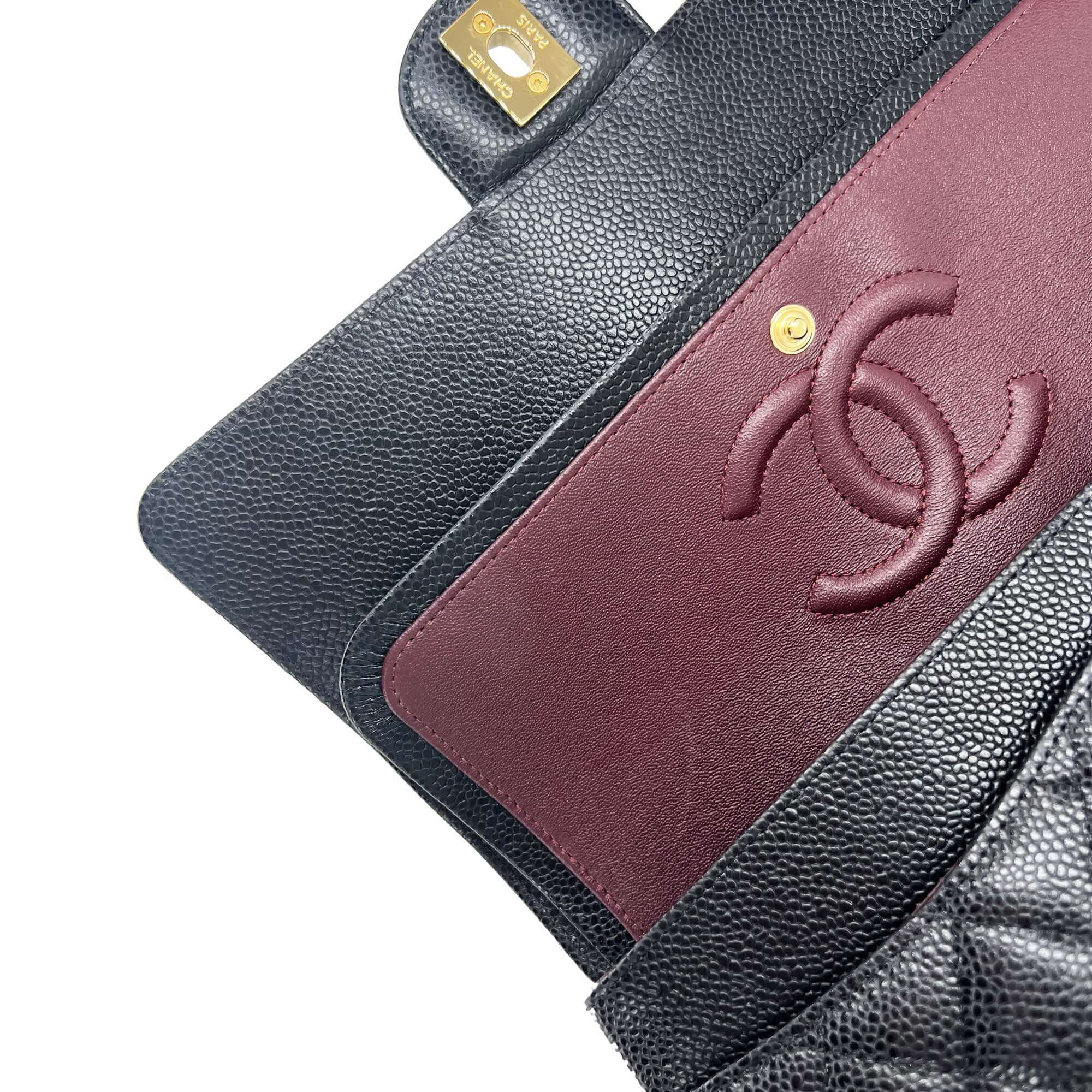 Chanel medium black caviar leather double flap closure bag