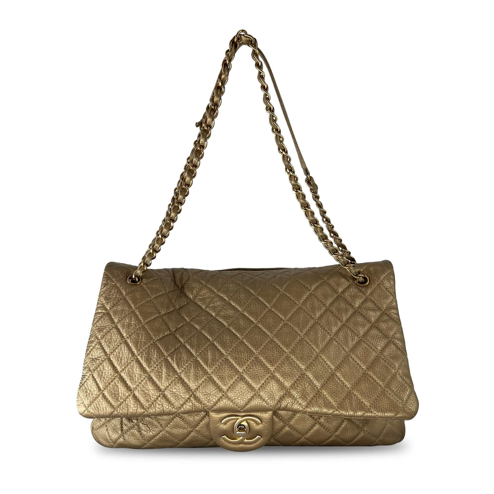 Chanel gold quilted leather travel bag
