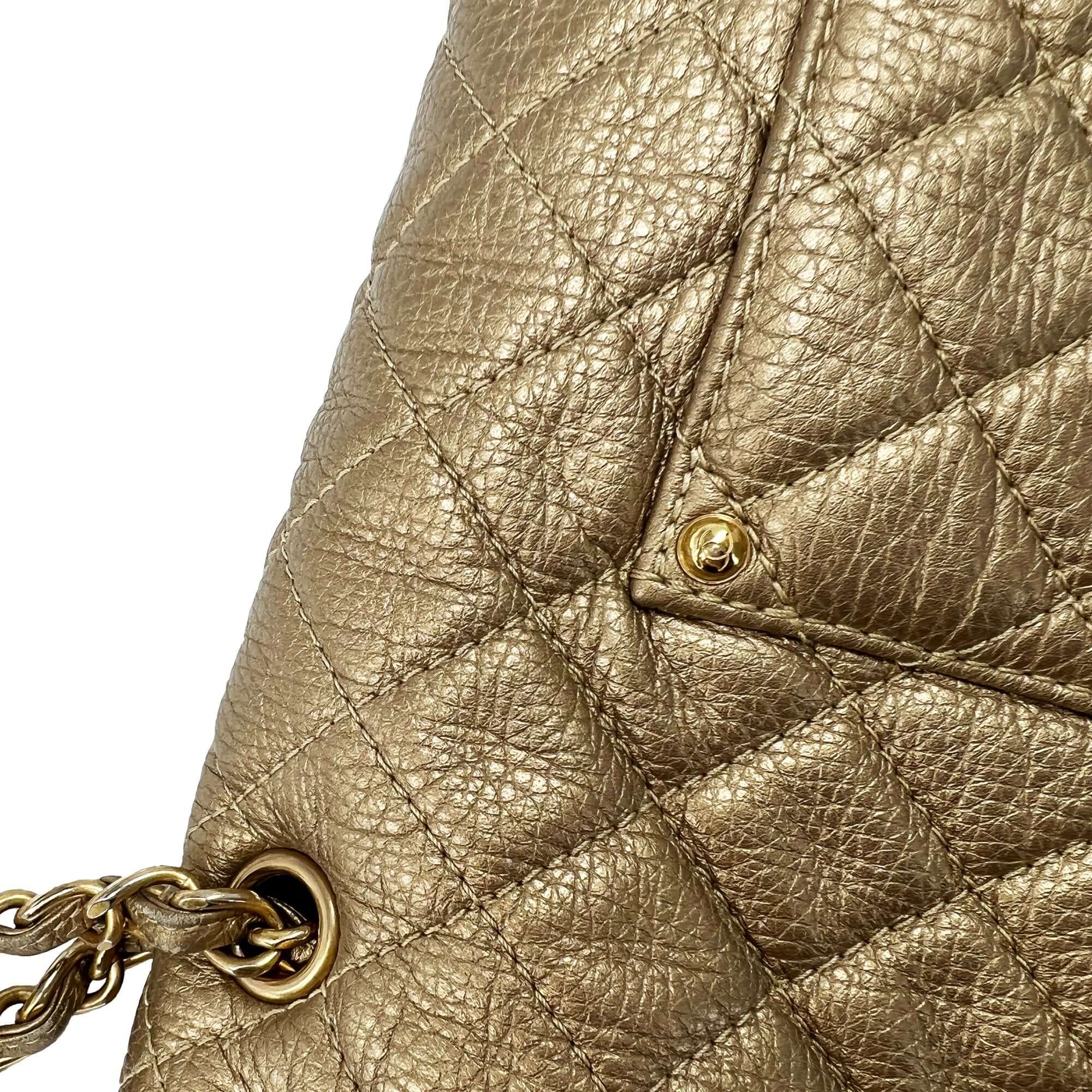 Chanel gold quilted leather travel bag