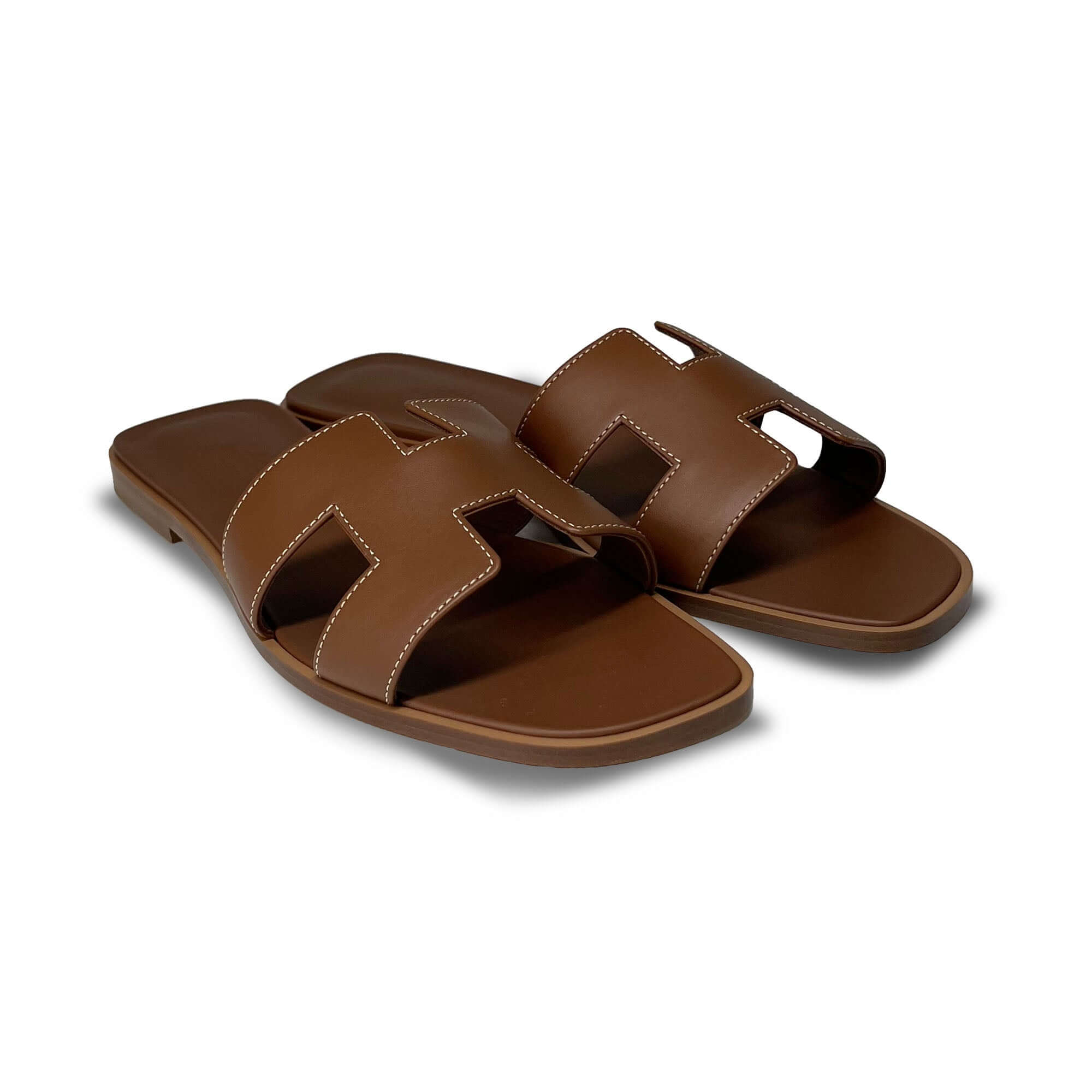Hermes Oran Designer Leather Slippers in Brown angle