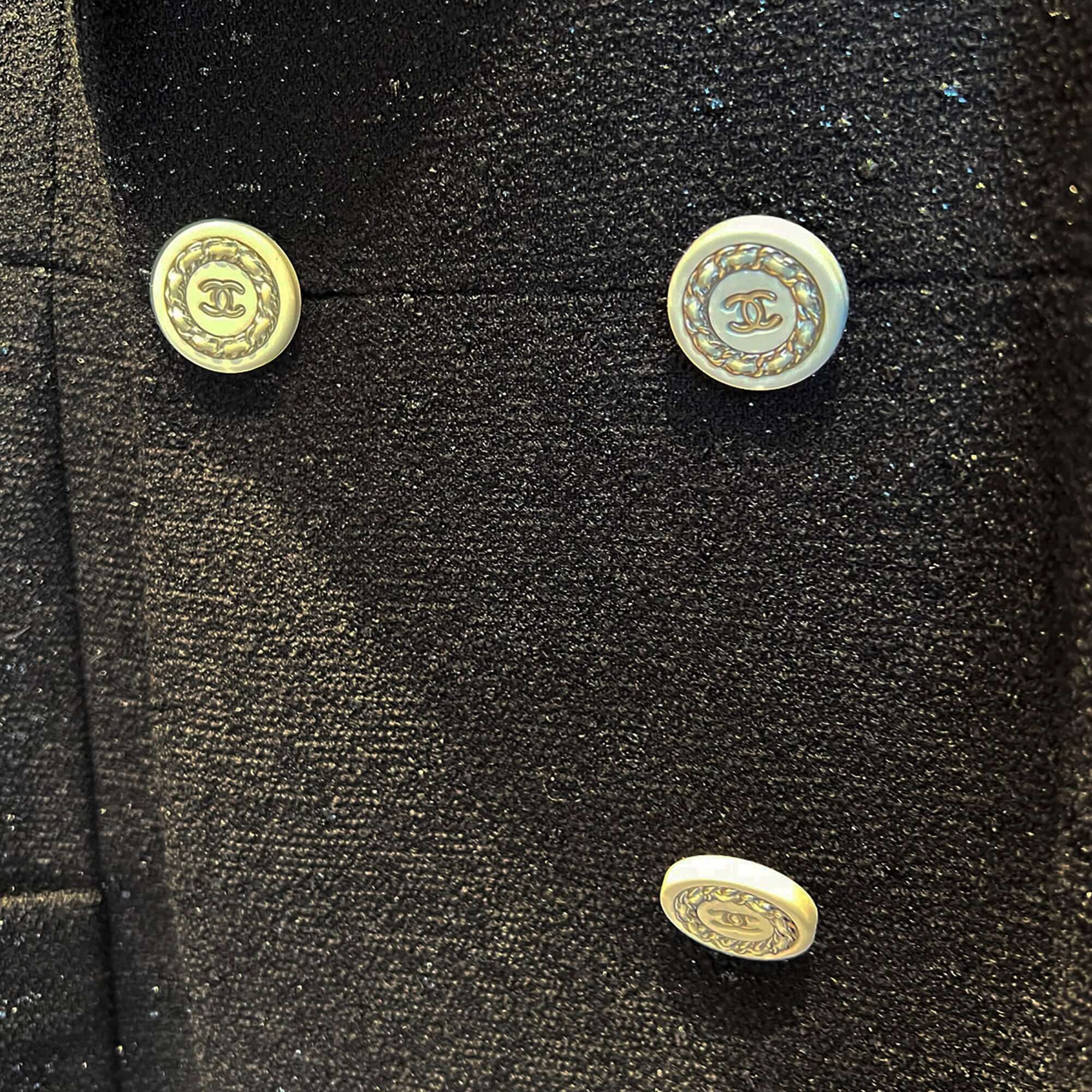 Chanel black jacket with white buttons