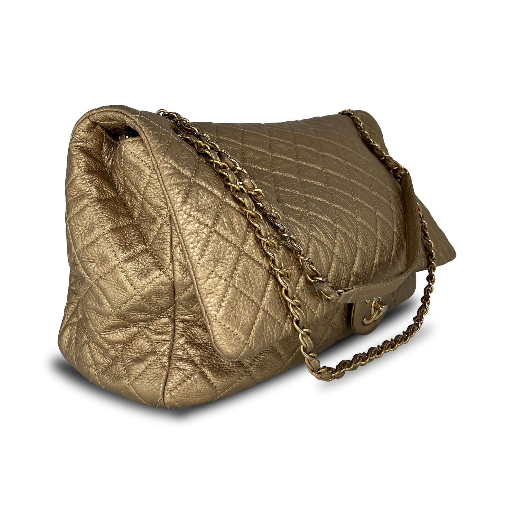Chanel gold quilted leather travel bag